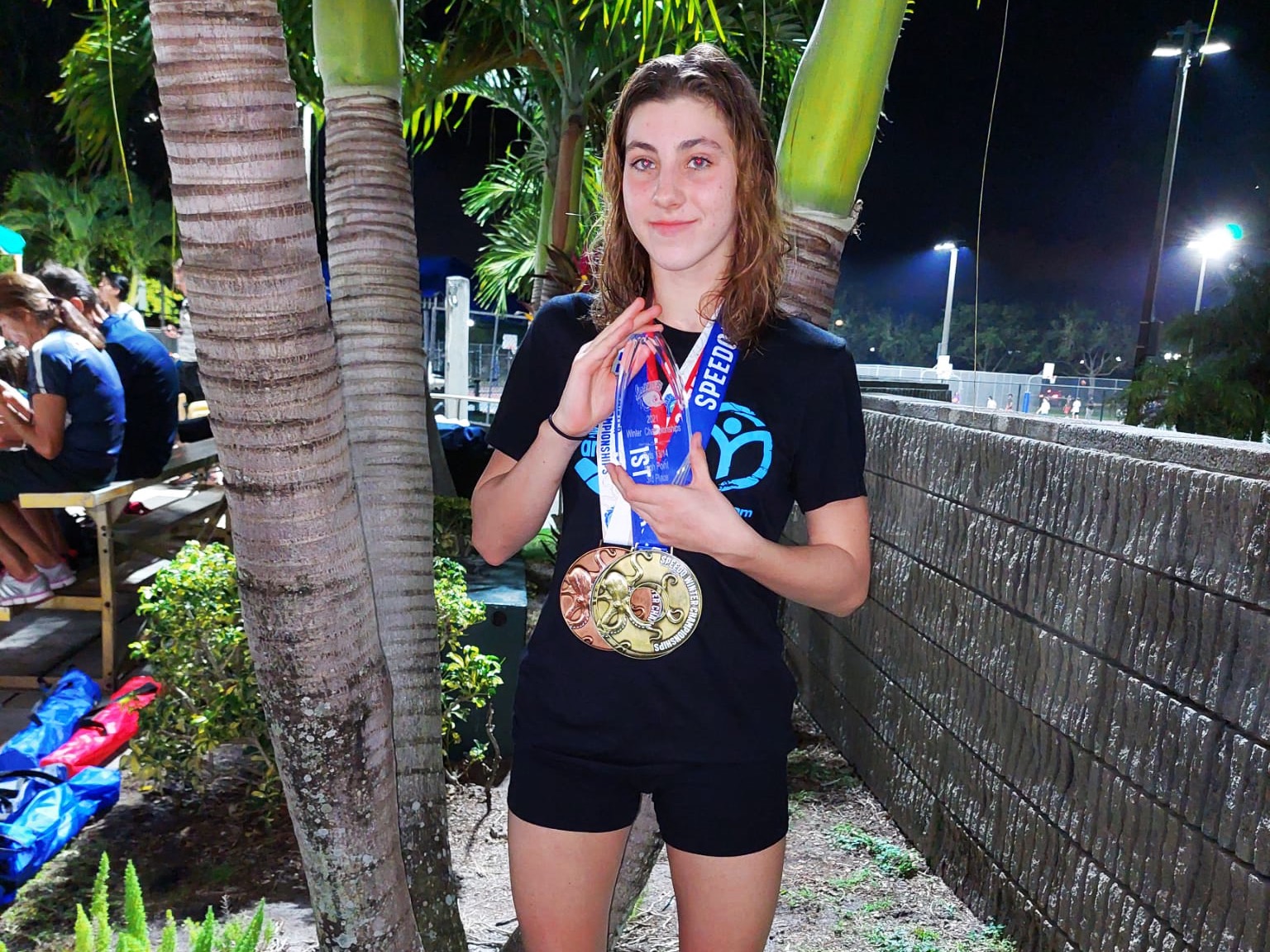 Martyna Kaps shows off her new hardware after finishing 3rd at the 2021 Speedo Championships in Florida